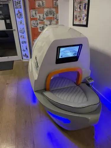 Infra Bike fully enclosed with touchscreen interface and ambient blue LED lighting