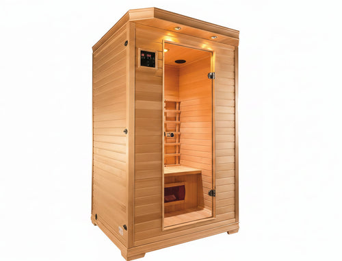 A freestanding wooden sauna cabin with a glass door, warm interior lighting, built-in wooden seating, and a small digital control panel on the exterior wall.