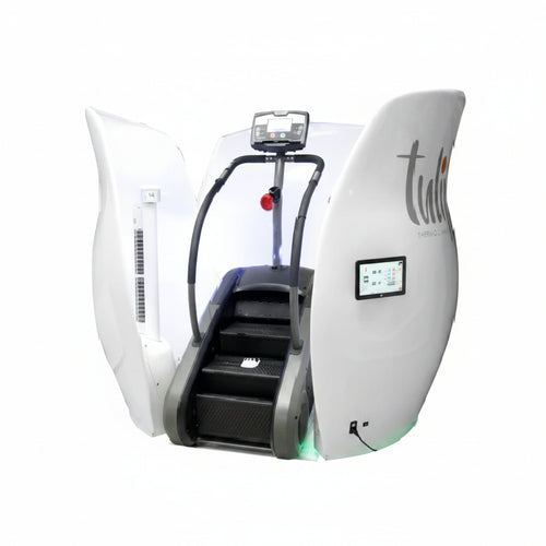A white and black stair climber exercise machine with wide light therapy side panels, a digital display screen, and a step tread, shown on a plain white background.