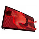 Man lying on a full-body red light therapy blanket illuminated by dense red LEDs against a white background