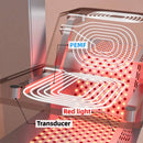 Close-up of the therapy bed showing PEMF coil patterns, red light panels, and a vibroacoustic transducer beneath the clear acrylic surface.