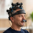 A man wearing the Neuro Pro 2 brain stimulation device, featuring 12,000 mW total power and customizable frequency pulse capabilities.