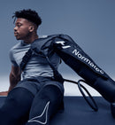 Hyperice Normatec 3 Full Body with the arm attachment.
