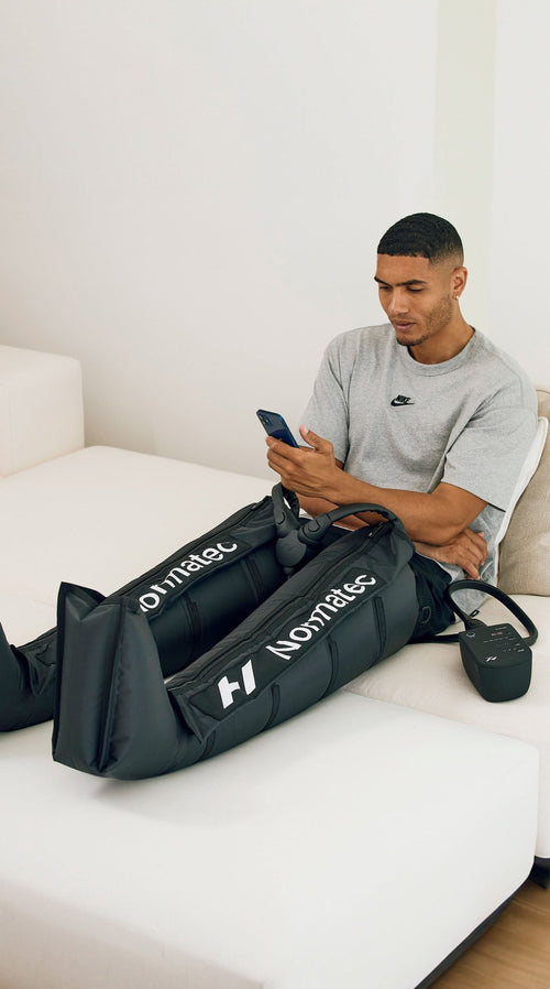 Hyperice Normatec 3 Legs worn during use.