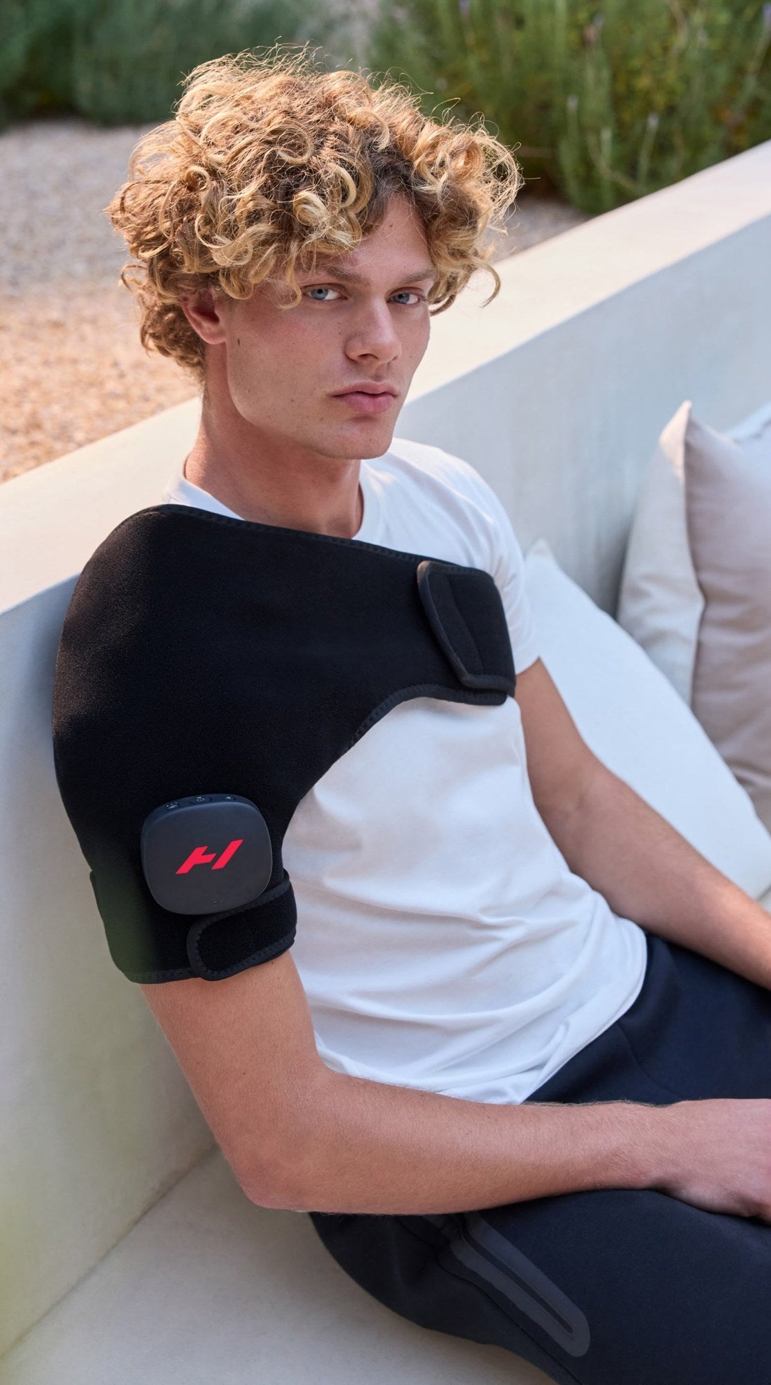 Hyperice Venom 2 Shoulder worn during use.