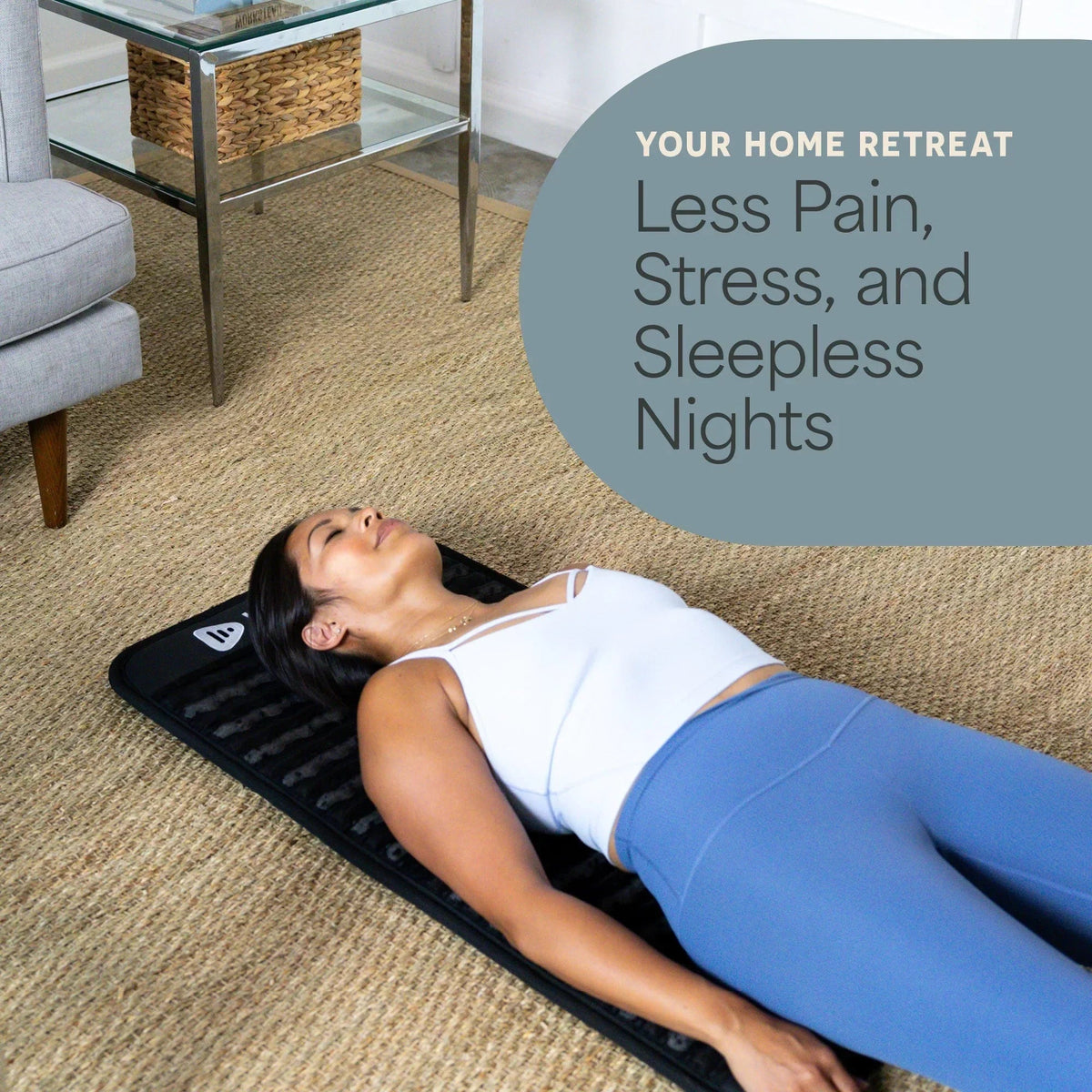 Woman lying on her back on the Lifepro InfraZen PEMF mat in a living room