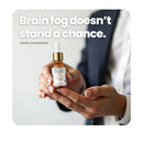 Hand holding Mind Expander bottle with brain fog text