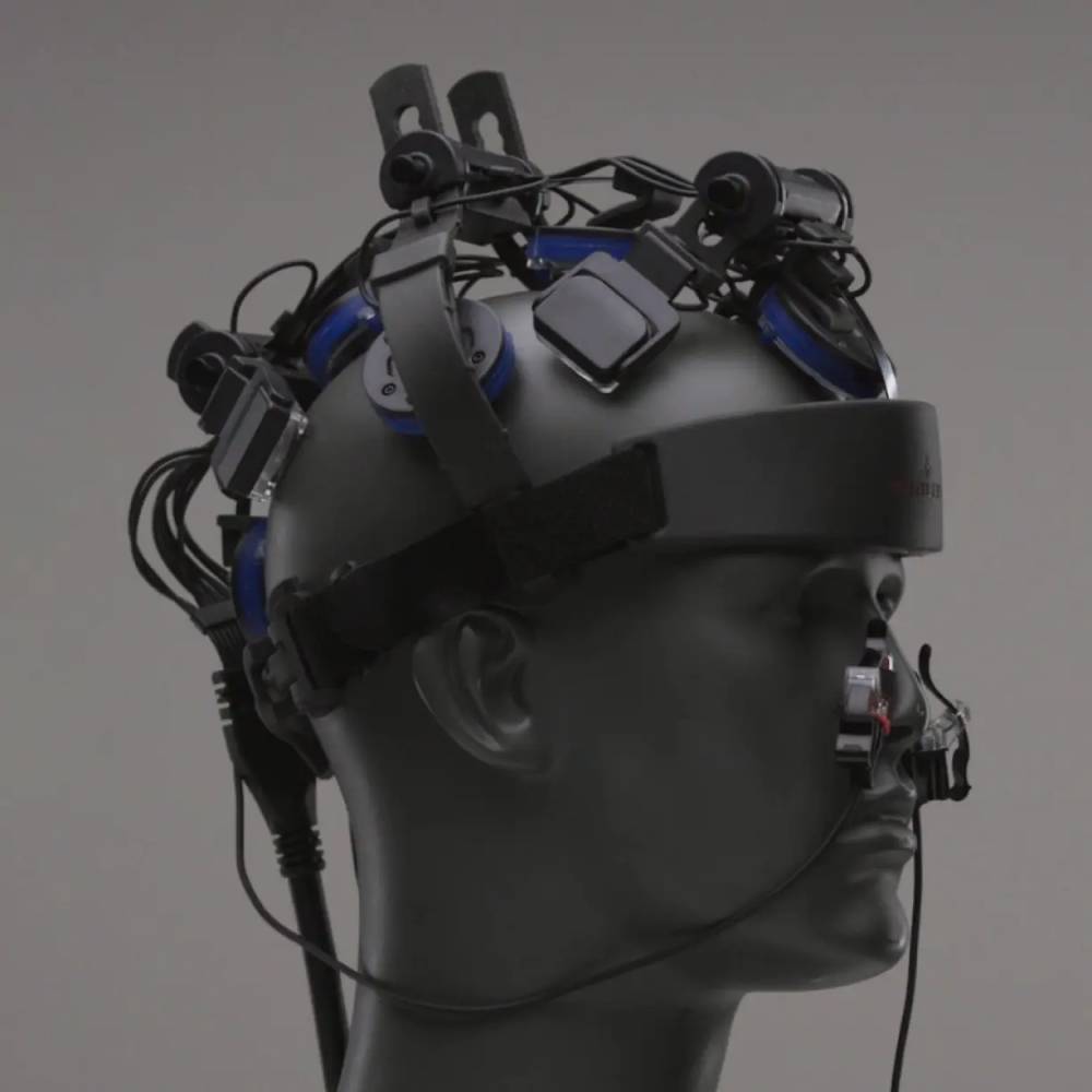 Profile view of the Neuro Pro 2 showing the transcranial LED modules and the intranasal gateway applicator for full-brain light therapy.