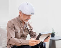 Man using Neuronic NR-1070 helmet connected to controller