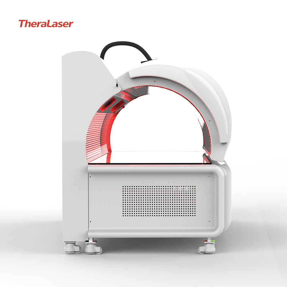 Side view of the TheraLaser red light therapy pod with the clamshell lid open, showing the ergonomic interior and ventilated base.