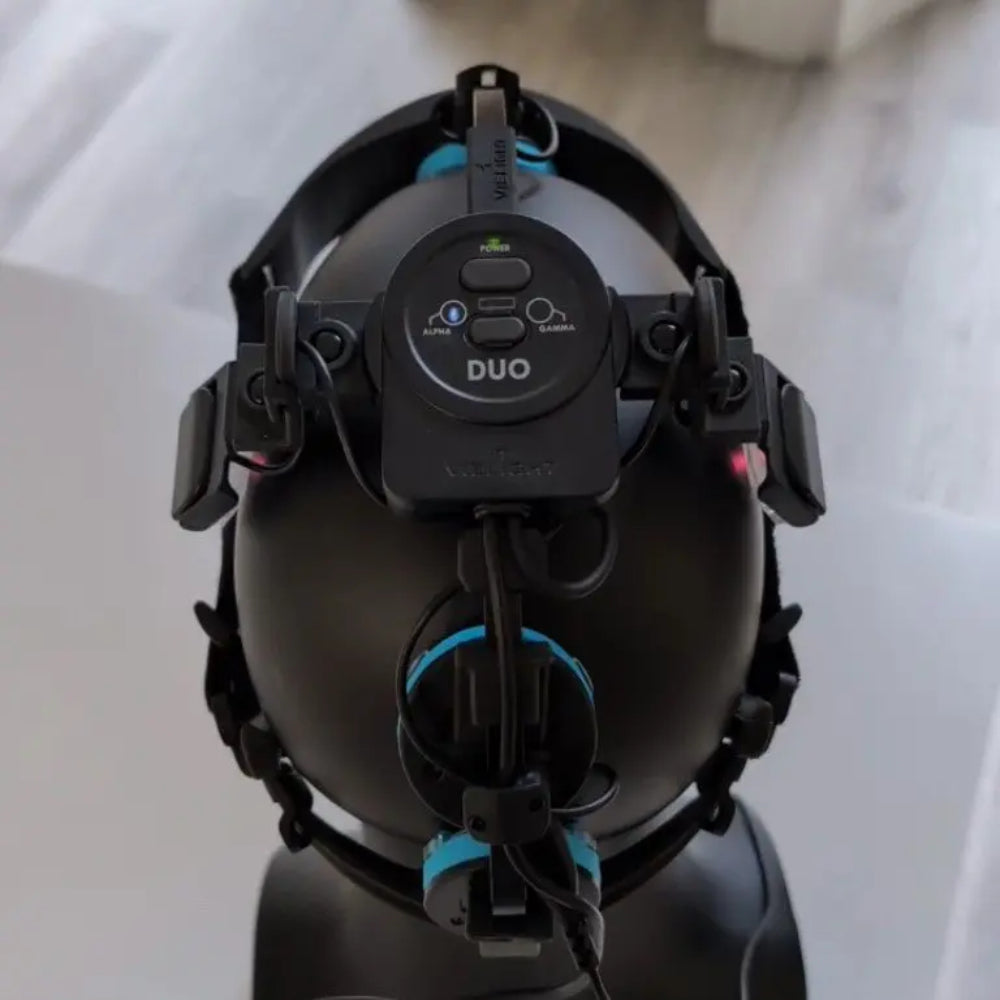 A Vielight Neuro Duo brain photobiomodulation device including the adjustable headset with LED modules, the intranasal applicator, and the handheld controller on a white background.