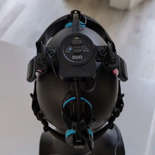 A Vielight Neuro Duo brain photobiomodulation device including the adjustable headset with LED modules, the intranasal applicator, and the handheld controller on a white background.