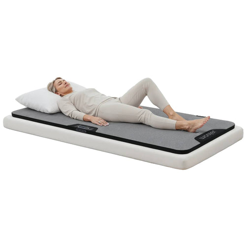 Transform your bed into a relaxing recovery space with the Woojer Sound Therapy Bed Mat